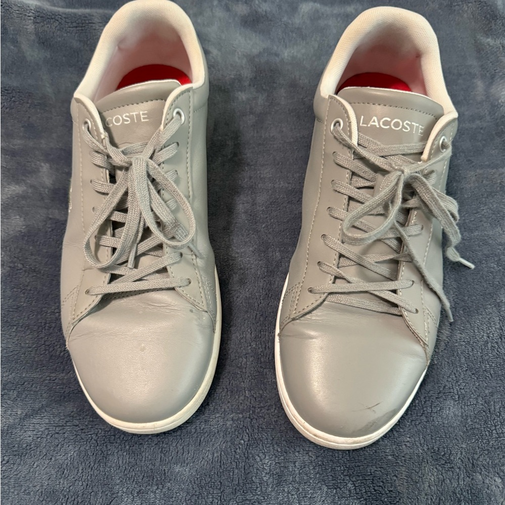 Lacoste silver gray shoes.